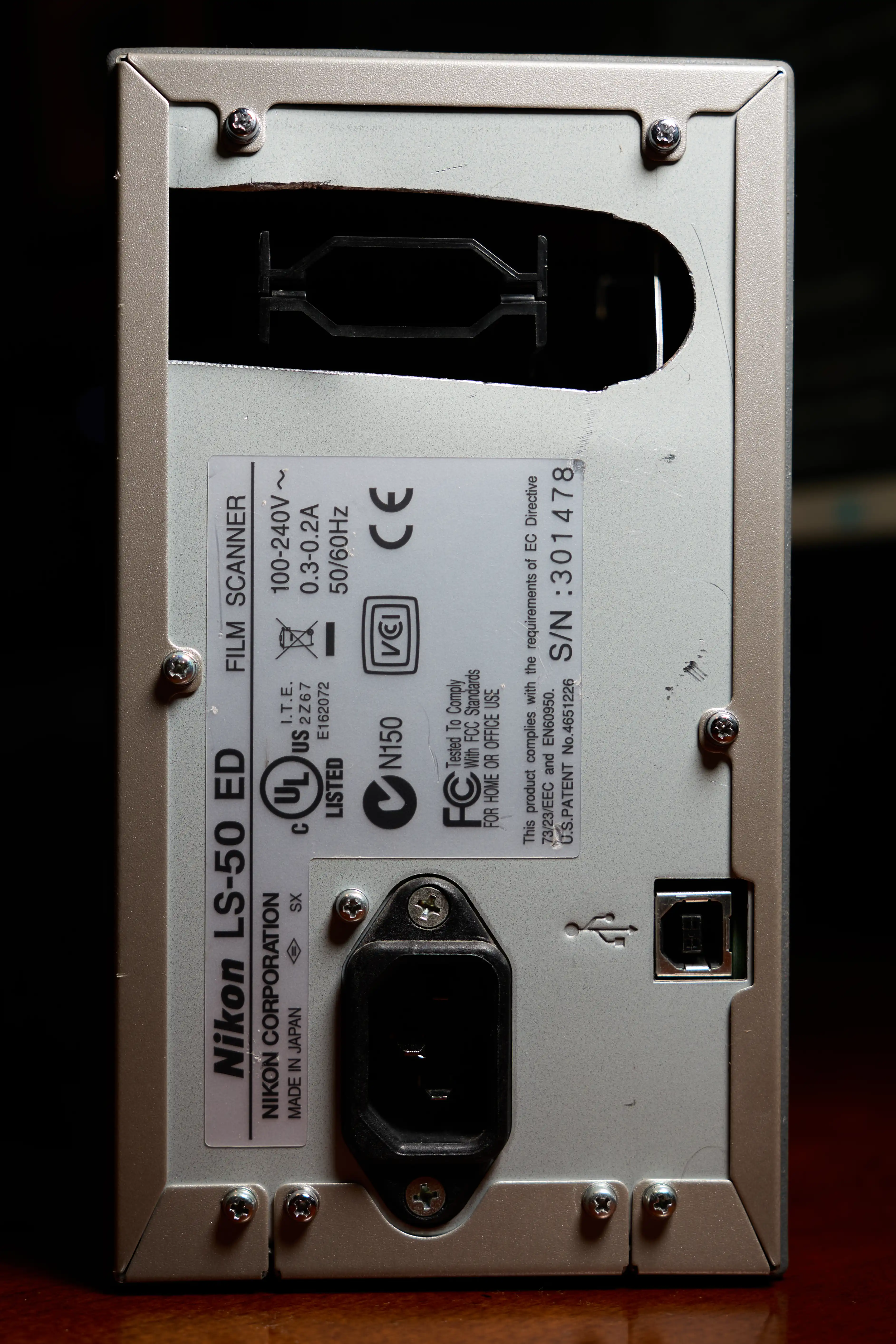 Nikon CoolScan V ED with hole cut in back to allow whole roll scanning